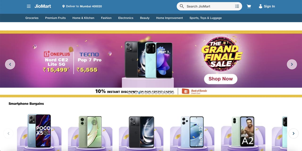 JioMart Store website displaying WhatsApp chatbot for grocery ordering FAQ support and nearest store directory lookup