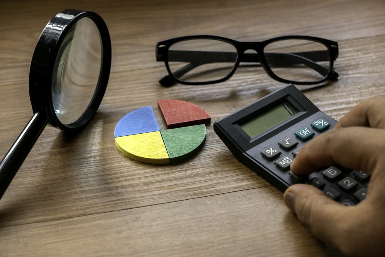 Data analysis workspace with reports, calculator, and magnifying glass for feedback review