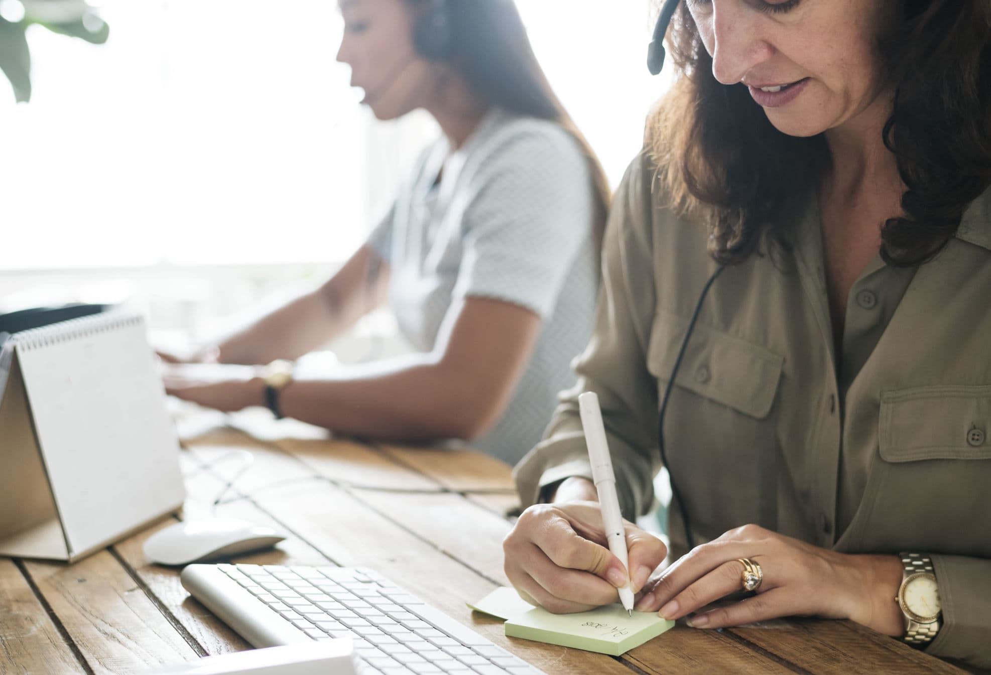 A customer service team reviewing chat tickets and canned response templates
