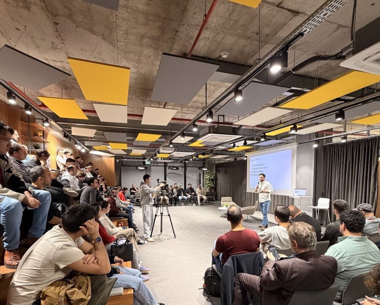 AI Meetup event in Ankara featuring a live presentation on artificial intelligence and product development with an engaged audience.