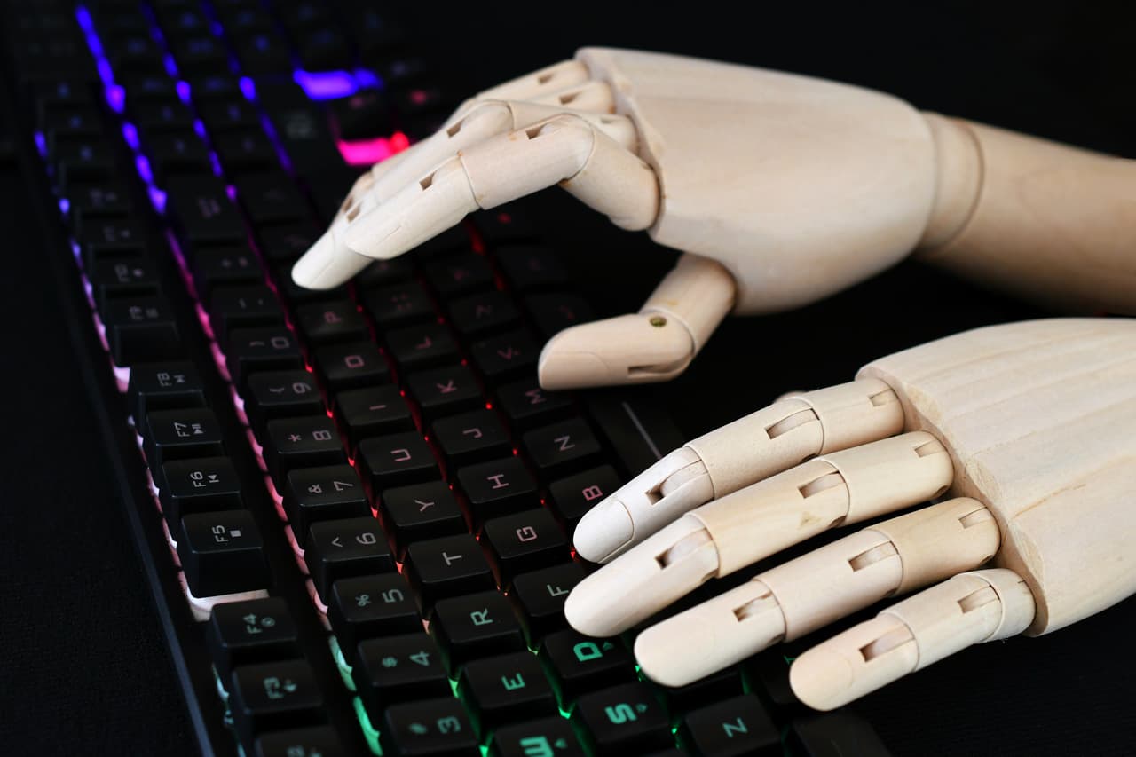 robot hands writing on the keyboard