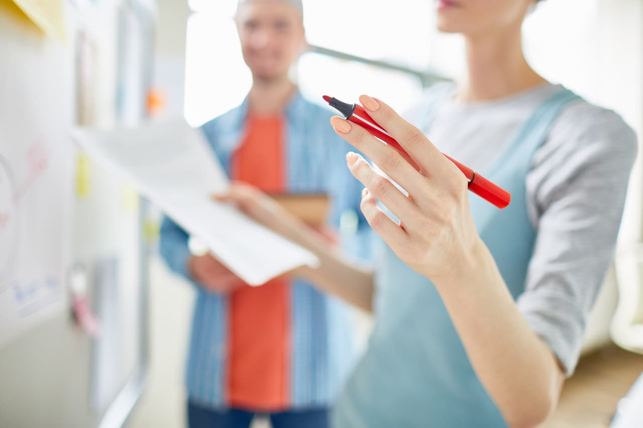 people taking notes and examining the sides of research