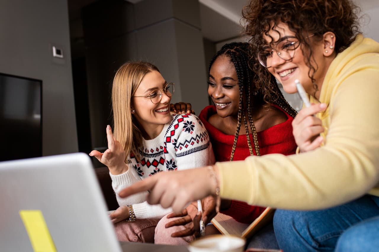 a group of female students learning with joy