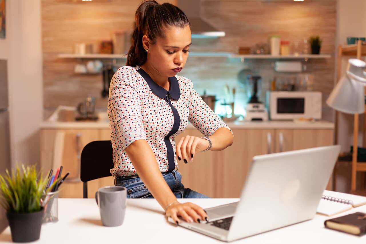 woman checking time and standing