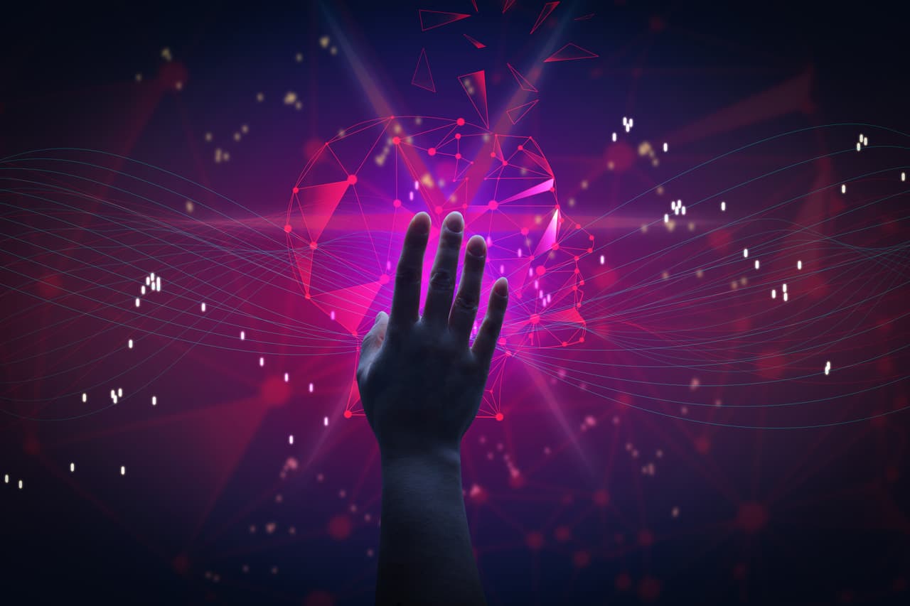 a hand touching a shining purple area