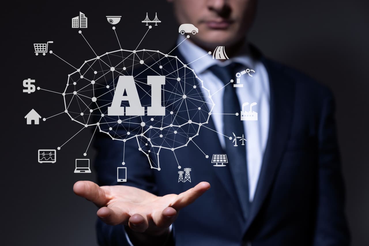A small business entrepreneur utilizing AI technology on his laptop for business growth and improved customer service
