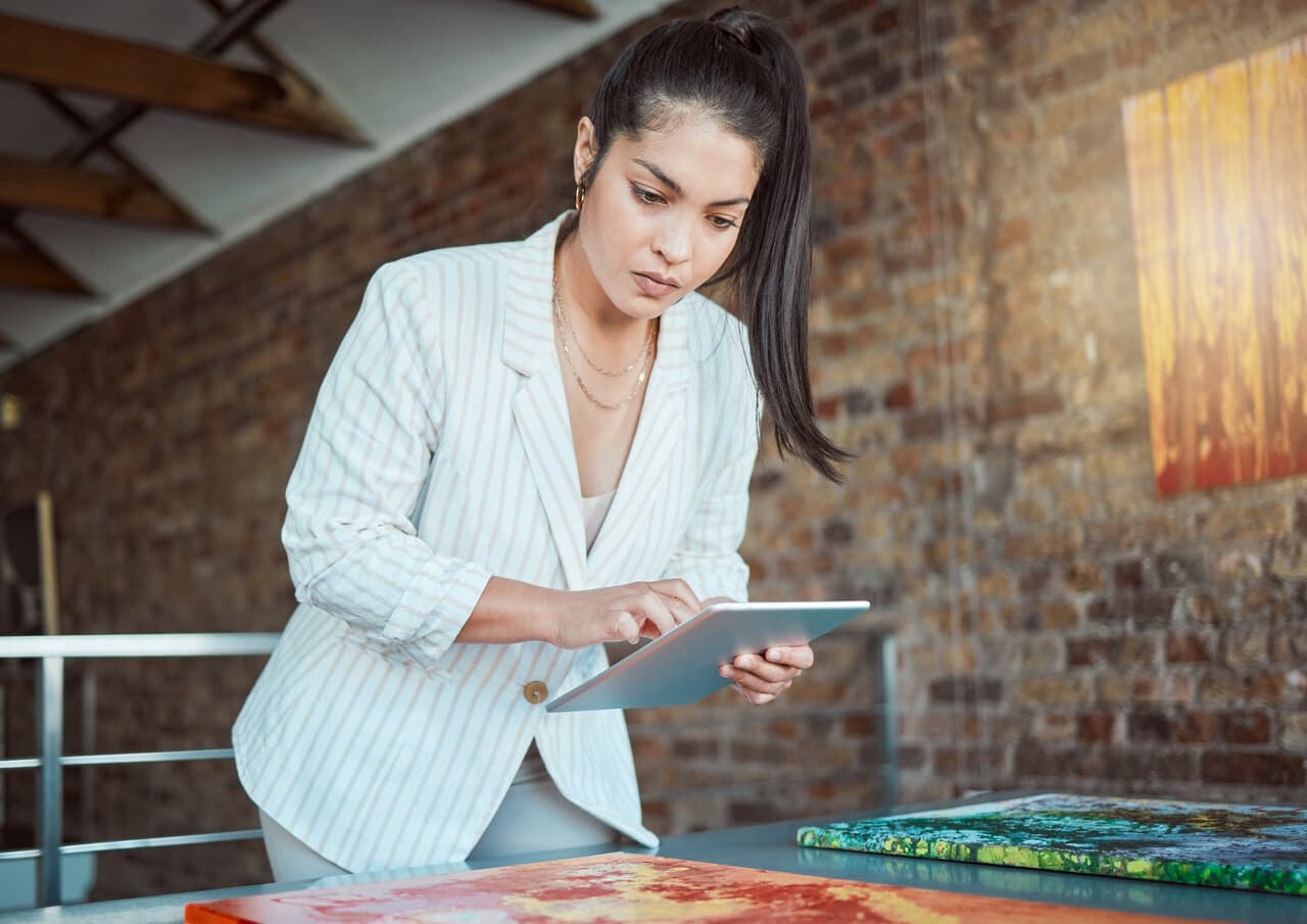 a woman searching for something on her tablet