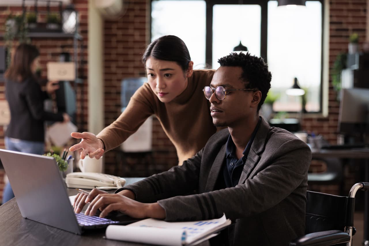 two people working and examining