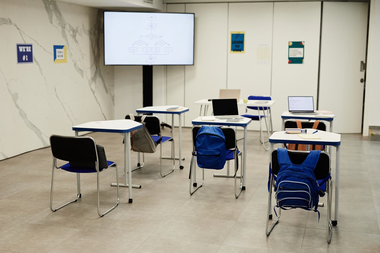 Empty modern classroom seen from the back of the room